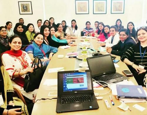 Participants posing for a photograph in between sessions